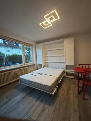 Ein Bett oder Betten in einem Zimmer der Unterkunft Einzimmerappartment München Solln