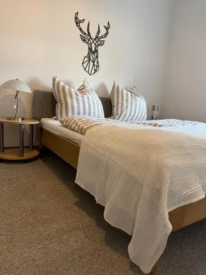 Ein Bett oder Betten in einem Zimmer der Unterkunft Seeperle Tutzing, zentral, fussläufig zum Starnbergersee