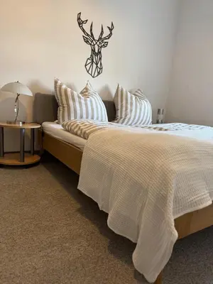 Ein Bett oder Betten in einem Zimmer der Unterkunft Seeperle Tutzing, zentral, fussläufig zum Starnbergersee