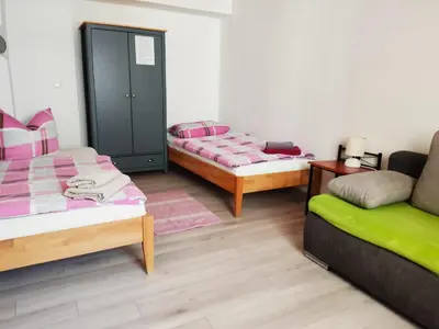 Ein Bett oder Betten in einem Zimmer der Unterkunft Müllers Monteur- und Gruppenunterkunft Gangkofen