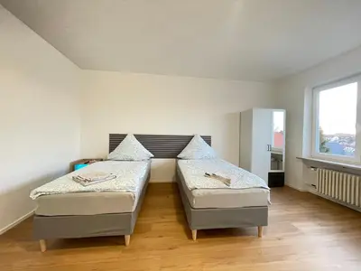 Ein Bett oder Betten in einem Zimmer der Unterkunft Miracle 6 Betts Apart mit Parkplatz