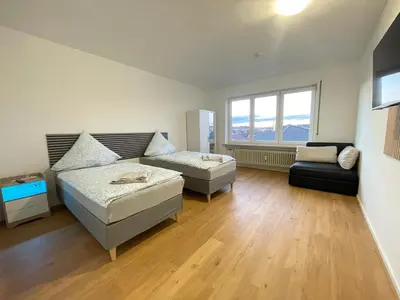 Ein Bett oder Betten in einem Zimmer der Unterkunft Miracle 6 Betts Apart mit Parkplatz