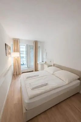 Ein Bett oder Betten in einem Zimmer der Unterkunft Munich Premium Guesthouse