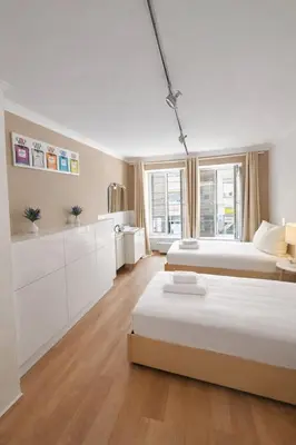 Ein Bett oder Betten in einem Zimmer der Unterkunft Munich Premium Guesthouse