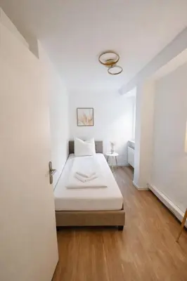 Ein Bett oder Betten in einem Zimmer der Unterkunft Munich Premium Guesthouse-2