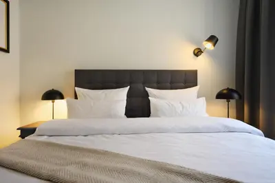 Ein Bett oder Betten in einem Zimmer der Unterkunft Munich Furnished Apartments