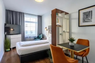 Ein Bett oder Betten in einem Zimmer der Unterkunft Munich Furnished Apartments