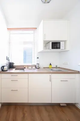 Küche/Küchenzeile in der Unterkunft Munich Furnished Apartments