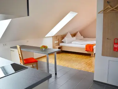 Ein Bett oder Betten in einem Zimmer der Unterkunft Apparthotel Ampertal
