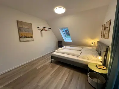 Ein Bett oder Betten in einem Zimmer der Unterkunft Grand Suite - Perfekt für 6-8! Parken Flughafen