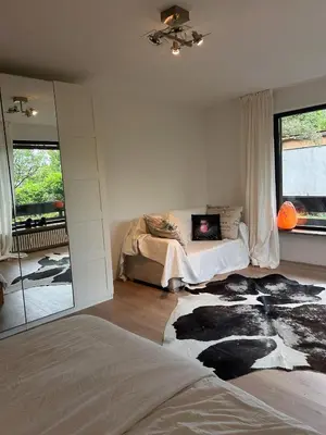 Ein Bett oder Betten in einem Zimmer der Unterkunft Oli Munich suburb Apartment Garden Balcony