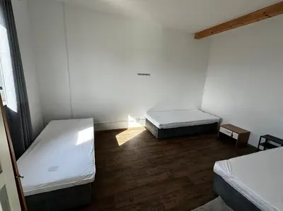 Ein Bett oder Betten in einem Zimmer der Unterkunft AB Pension Dachau