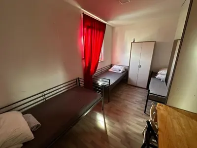Ein Bett oder Betten in einem Zimmer der Unterkunft AB Pension Dachau