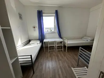 Ein Bett oder Betten in einem Zimmer der Unterkunft AB Pension Dachau