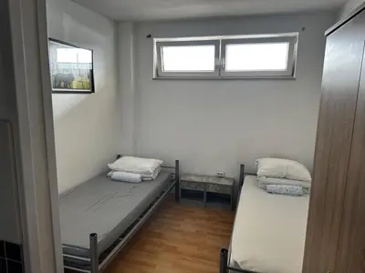 Ein Bett oder Betten in einem Zimmer der Unterkunft AB Pension Dachau