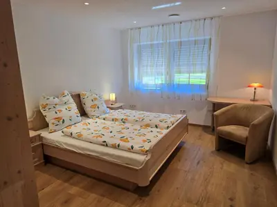 Ein Bett oder Betten in einem Zimmer der Unterkunft Ferienwohnung am Eichberg