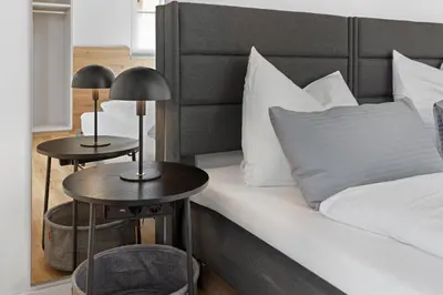Ein Bett oder Betten in einem Zimmer der Unterkunft BALANCED Münsing Apartments, vollausgestatte Ferienwohnungen Nähe Starnberger See