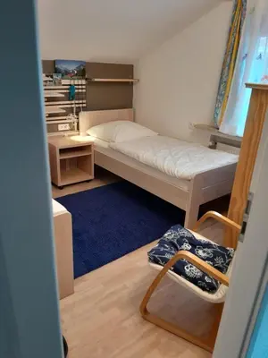 Ein Bett oder Betten in einem Zimmer der Unterkunft Ferienwohnung Alpenpanorama