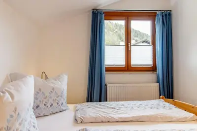 Ein Bett oder Betten in einem Zimmer der Unterkunft Ferienwohnung Alpenpanorama