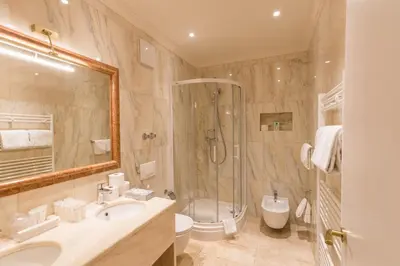 Ein Badezimmer in der Unterkunft Grand Hotel Palladium