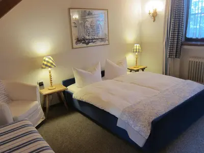 Ein Bett oder Betten in einem Zimmer der Unterkunft Ferienwohnungen Elisabeth am See