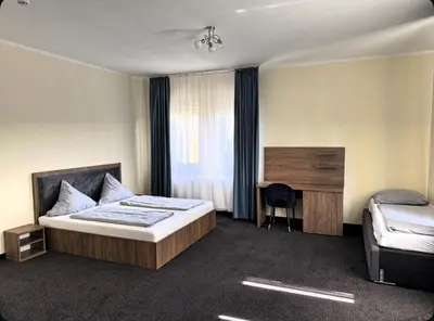 Ein Bett oder Betten in einem Zimmer der Unterkunft Art Hotel