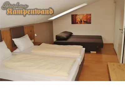 Ein Bett oder Betten in einem Zimmer der Unterkunft Gasthof Kampenwand Aschau