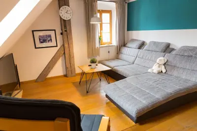 Ein Sitzbereich in der Unterkunft Ferienwohnung im Bortenmacherhaus