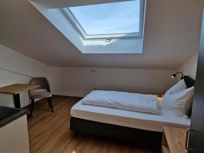 Ein Bett oder Betten in einem Zimmer der Unterkunft Gästehaus Paartal