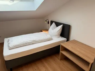 Ein Bett oder Betten in einem Zimmer der Unterkunft Gästehaus Paartal