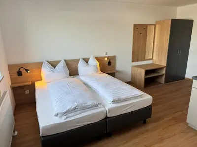 Ein Bett oder Betten in einem Zimmer der Unterkunft Gästehaus Paartal
