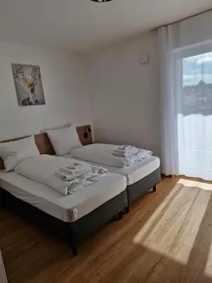 Ein Bett oder Betten in einem Zimmer der Unterkunft Gästehaus Paartal