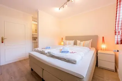 Ein Bett oder Betten in einem Zimmer der Unterkunft Ferienhaus Achendamm