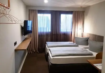 Ein Bett oder Betten in einem Zimmer der Unterkunft ARRIVEL Hotel Kirchheim - bisher Novitel