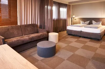 Ein Bett oder Betten in einem Zimmer der Unterkunft ARRIVEL Hotel Kirchheim - bisher Novitel