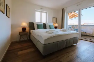 Ein Bett oder Betten in einem Zimmer der Unterkunft Ferienwohnung Leopoldine Chiemgau