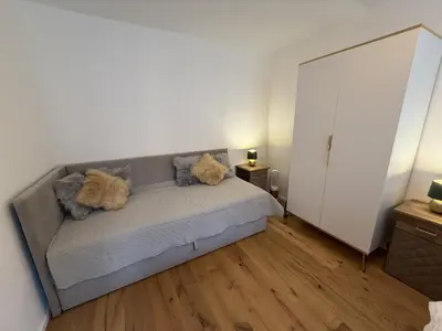 Ein Bett oder Betten in einem Zimmer der Unterkunft Hochwertige GoldenKey Suite mitten in der Altstadt