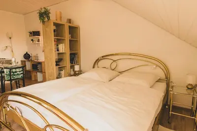 Ein Bett oder Betten in einem Zimmer der Unterkunft Chic apartment between Munich and Lake Starnberg