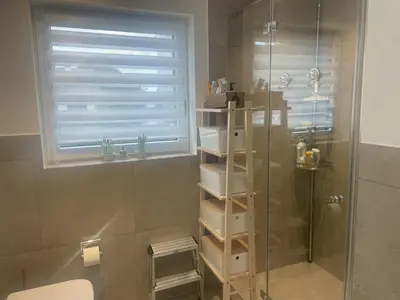 Ein Badezimmer in der Unterkunft October