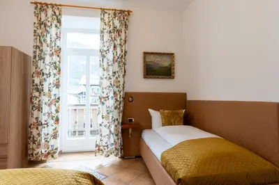 Ein Bett oder Betten in einem Zimmer der Unterkunft Höllental heritage house - Alpspitzblick - 1