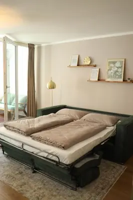 Ein Bett oder Betten in einem Zimmer der Unterkunft City Quartier 4 Traumlage Augsburg Zentrum