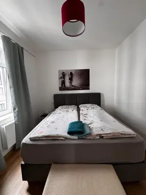 Ein Bett oder Betten in einem Zimmer der Unterkunft Aby Wohnungen