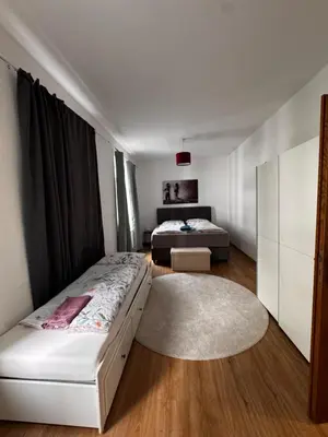 Ein Bett oder Betten in einem Zimmer der Unterkunft Aby Wohnungen