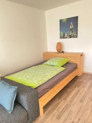 Ein Bett oder Betten in einem Zimmer der Unterkunft Gemütliches Apartment in zentraler Lage