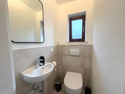 Ein Badezimmer in der Unterkunft Perfekt für 4-6! Küche Garage S-Bahnhof Flughafen