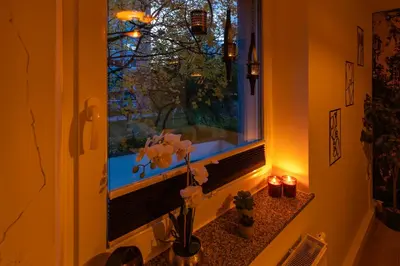 Ein Garten an der Unterkunft Stilvolles Wohlfühl-Apartment mit Balkon