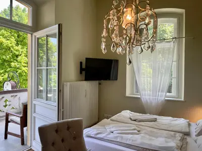 Ein Bett oder Betten in einem Zimmer der Unterkunft ciao-aschau Haus Burg Studio-Apartment101