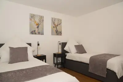Ein Bett oder Betten in einem Zimmer der Unterkunft Ferienwohnung Alpenzeit Unterwössen im Chiemgau