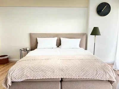 Ein Bett oder Betten in einem Zimmer der Unterkunft Charmantes Appartement im 25 OG mit Aussicht und 60 Zoll TV