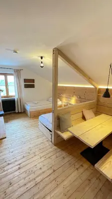 Ein Bett oder Betten in einem Zimmer der Unterkunft RamsAu-das Gasthaus